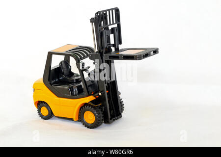 Small forklift vehicle with pallet in fork Stock Photo