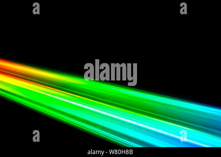 Beams of light refracting and creating a rainbow spectrum of colours against a black background Stock Photo