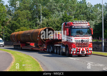 A lorry carrying an oversize load on a Scottish road, Leven, Fife. Stock Photo