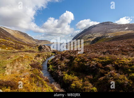 Looking down the length of Llyn Cowlyd reservoir, which supplys water to the local hydro electric power station at Dolgarrog, Snowdonia Stock Photo