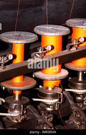 Cotton bobbins on a weaving loom Stock Photo
