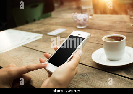 Smartphone in hands. Clipping path included. Stock Photo