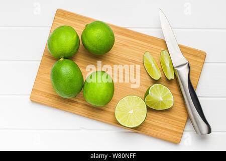 The green sliced lime on cutting board. Stock Photo