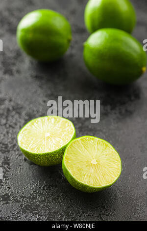 The green sliced lime on black table. Stock Photo