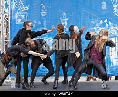 Edinburgh, Royal Mile, Scotland, UK. 7th August 2019. Sixth day of the frolics on the High Street, on stage cast members of Macbeth-Something Wicked this way comes. Stock Photo