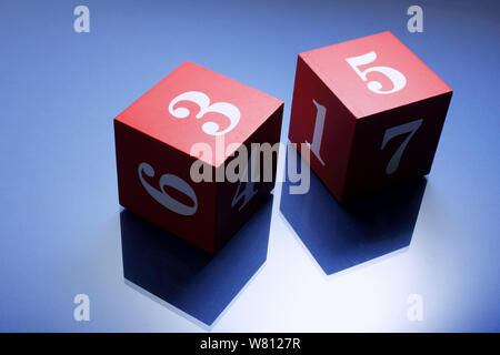 Number Cubes on Blue Background Stock Photo