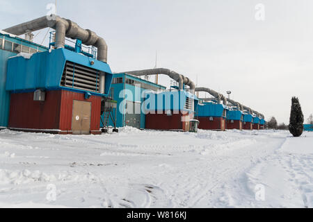 Winter view on gas compressor station in Ukraine. The equipment at gas field. Stock Photo