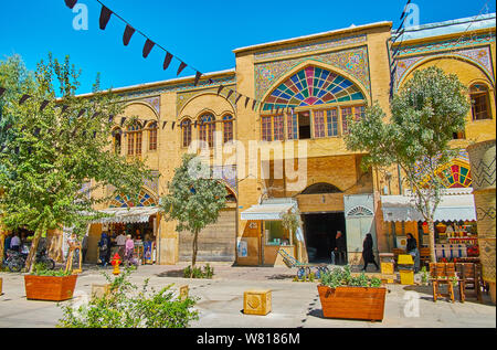 SHIRAZ, IRAN - OCTOBER 14, 2017: Historical architecture of Zand street with covered market, decorated with portals, ornate tile decorations, stained Stock Photo