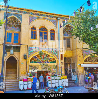 SHIRAZ, IRAN - OCTOBER 14, 2017: Zand street is one of the main tourist destination, full of souvenir stores, spice stalls, carpet and leather worksho Stock Photo