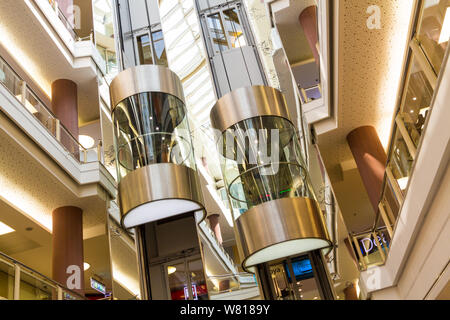Two panorama glass lift lifts in Mammut shopping centre, Budapest, Hungary Stock Photo