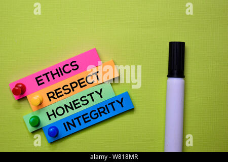 Ethics, Respect, Honesty, Integrity text on sticky notes isolated on green desk. Mechanism Strategy Concept Stock Photo