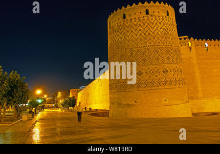 The evening  view of the extant leaning tower of medieval Karim Khan citadel, decorated with carved brick patterns, Shiraz, Iran Stock Photo