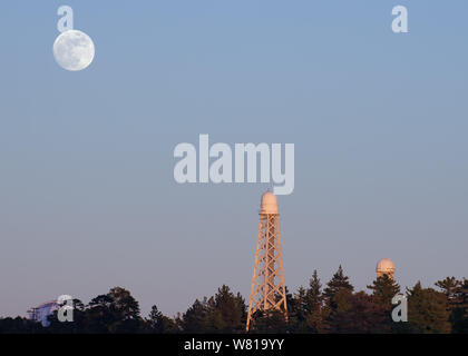 Moon rising at Mount Wilson Observatory in California. Mt Wilson is located on San Gabriel Mountains. Stock Photo