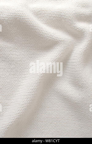 White woolen sweater, texture detail close up. Stock Photo