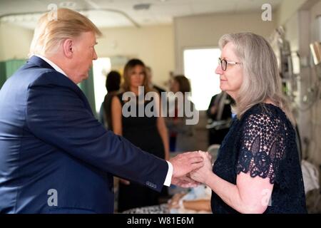 Dayton, United States Of America. 07th Aug, 2019. U.S President Donald Trump visits with family members at Miami Valley Hospital August 7, 2019 in Dayton, Ohio. Nine people were killed in a shooting in the Oregon District of Dayton, Ohio the day after 31 people were killed in mass shootings in El Paso. Credit: Planetpix/Alamy Live News Stock Photo