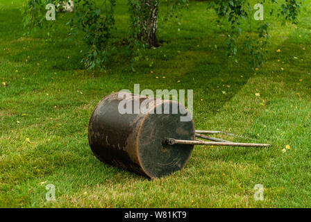 hand roller for laying the lawn is on the grass outdoor Stock Photo