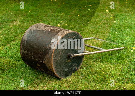 hand roller for laying the lawn is on the grass outdoor Stock Photo