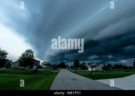 A storm shelf over a neighborhood Stock Photo