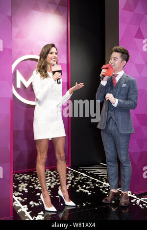 Brazilian model Alessandra Ambrosio, left, attends an unveiling ceremony of her own wax figure at the Madame Tussauds wax museum in Shanghai, China, 6 Stock Photo