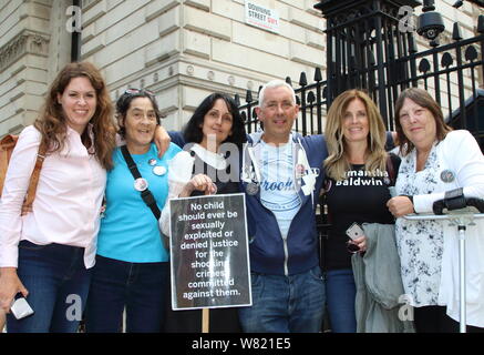 Beechholme Warriors group gather outside Parliament as they take part during the protest.Beech Holme Warriors group Protest outside Parliament and Downing Street, Fighting for the rights of children not to live in fear of abuse and for Survivors to get justice. Stock Photo