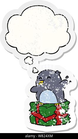 cartoon penguin on present with thought bubble as a distressed worn sticker Stock Vector