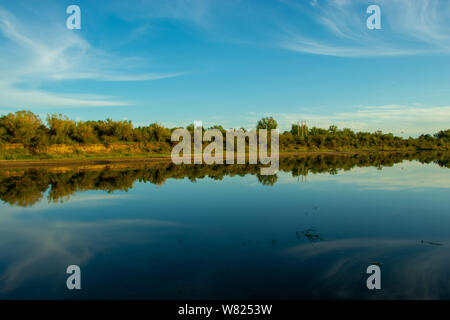 Peaceful evening view of the South Saskatchewan River in Saskatoon Saskatchewan Canada Stock Photo
