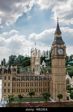 Brussels, Belgium - June 22, 2019: Mini-Europe exhibition park. London Big Ben clock tower and Parliament House built in miniature in park under blue Stock Photo