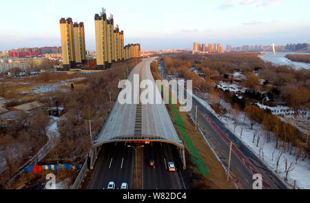 Aerial view of the construction site of an elevated road fully covered by noise-reduction shelters in Shenyang city, northeast China's Liaoning provin Stock Photo