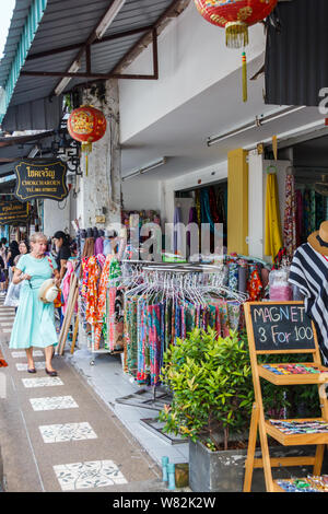 Phuket, Thailand - November 2nd 2016: Tourists shopping on Thalang Road. This is the heart of the Old Town. Stock Photo