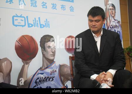 --FILE--Retired Chinese basketball star Yao Ming attends a ceremony for Shanghai Bilibili, a Chinas basketball club, to prepare for CBA 2016/2017 Seas Stock Photo