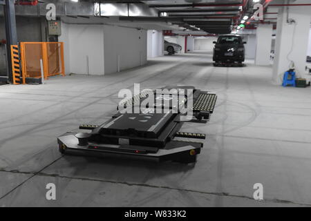An automated guided vehicle robot is pictured in China's first AGV robot parking lot in Nanjing city, east China's Jiangsu province, 8 January 2017. Stock Photo