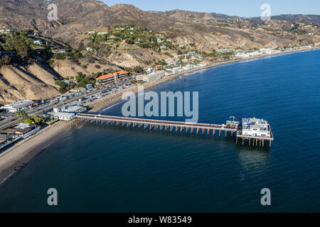 Aerial of historic Malibu Pier, Pacific Coast Highway and Santa Monica Bay near Los Angeles in scenic Southern California.