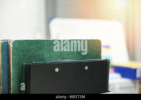 Documents in files placed in the filing cabinet / business paper document file sort in a office desk Stock Photo