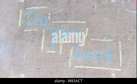 the words "Do Your Best" written with sidewalk chalk on gray concrete pavement background Stock Photo