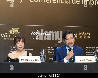 South Korean actress Moon Jeong-hee, left, and actor Jung Jin-young attend a press conference to promote their new movie 'Pandora' during the 1st Inte Stock Photo