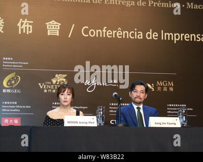 South Korean actress Moon Jeong-hee, left, and actor Jung Jin-young attend a press conference to promote their new movie 'Pandora' during the 1st Inte Stock Photo