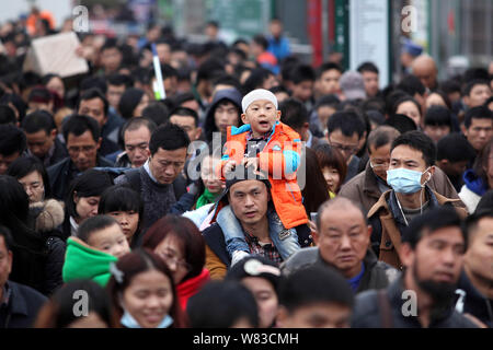 --FILE--A crowd of Chinese passengers queue up to enter the Guangzhou Railway Station before the Chinese New Year holiday during the Spring Festival t Stock Photo