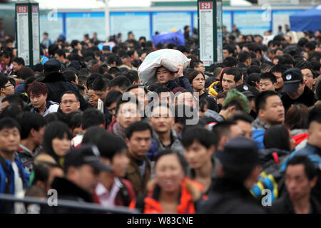 --FILE--A crowd of Chinese passengers queue up to enter the Guangzhou Railway Station before the Chinese New Year holiday during the Spring Festival t Stock Photo