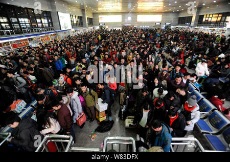 --FILE--A crowd of Chinese passengers queue up at the Beijing West Railway Station as they are going back home by train for the Chinese New Year holid Stock Photo