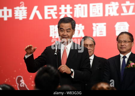 --FILE--Hong Kong Chief Executive Leung Chun-ying, front, delivers a speech at a celebration event for the 67th anniversary of the founding of the Peo Stock Photo