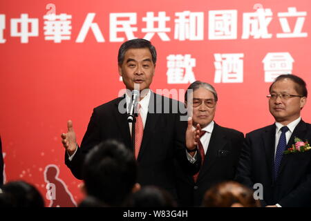 --FILE--Hong Kong Chief Executive Leung Chun-ying, front, delivers a speech at a celebration event for the 67th anniversary of the founding of the Peo Stock Photo