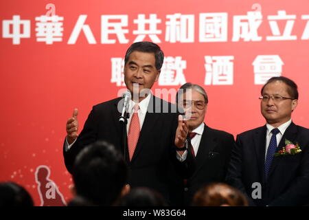 --FILE--Hong Kong Chief Executive Leung Chun-ying, front, delivers a speech at a celebration event for the 67th anniversary of the founding of the Peo Stock Photo