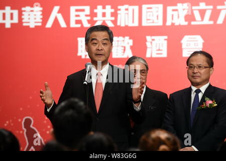 --FILE--Hong Kong Chief Executive Leung Chun-ying, front, delivers a speech at a celebration event for the 67th anniversary of the founding of the Peo Stock Photo