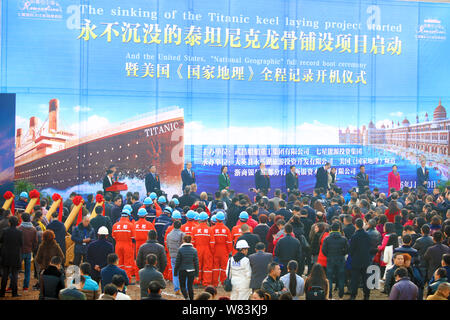 Chinese workers attend the project launching ceremony of building a full-scale replica of the Titanic passenger liner in Daying county, Suining city, Stock Photo