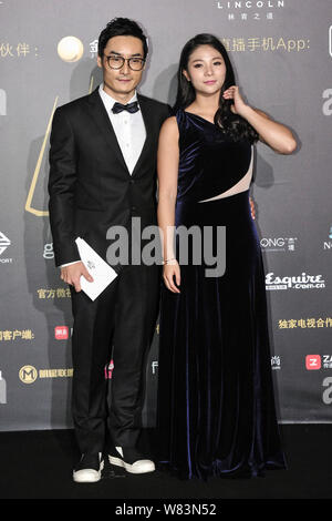 Chinese diving couple Qin Kai, left, and He Zi arrive on the red carpet for the Esquire Man at his Best Awards 2016 in Beijing, China, 7 December 2016 Stock Photo