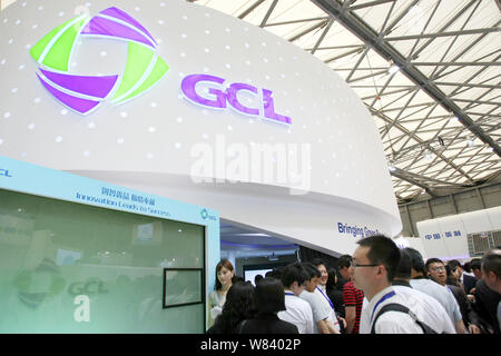 --FILE--People visit the stand of Chinese photovoltaic material manufacturer GCL (Golden Concord Holdings Limited) during the 7th International Photov Stock Photo