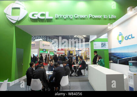 --FILE--People visit the stand of Chinese photovoltaic material manufacturer GCL (Golden Concord Holdings Limited) during a photovoltaic industry exhi Stock Photo