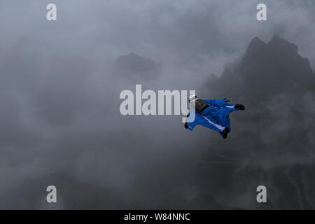 Wingsuit flier Ellen Brennan of the United States competes during the qualification of World Wingsuit League (WWL) China Grand Prix 2016 on Tianmen Mo Stock Photo