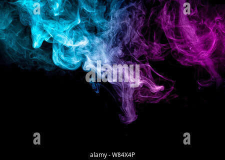 Cloud of pink and blue smoke on a black isolated background. Background from the smoke of vape Stock Photo