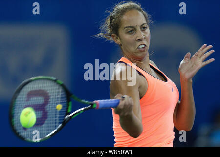 Madison Keys of the United States returns a shot to Simona Halep of Romania in their women's singles quarterfinal match during the WTA Wuhan Open 2016 Stock Photo